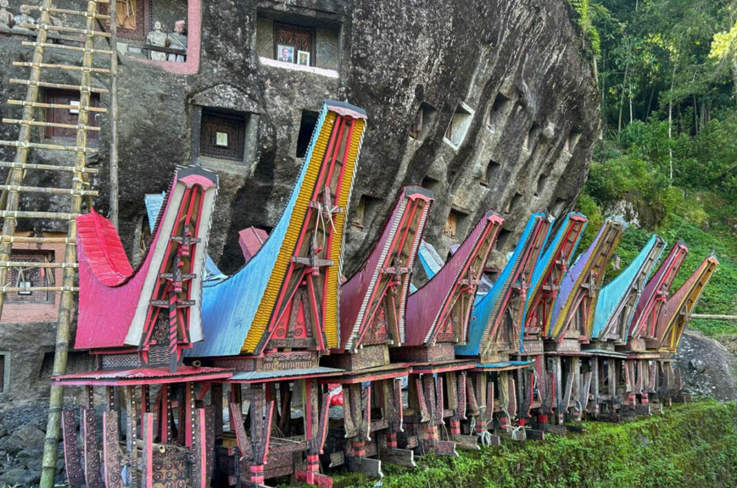 Rock tombs and wooden coffins of the Toraj people